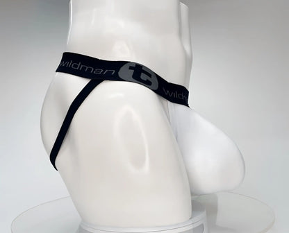 White jockstrap on a mannequin with a large pouch and a black branded waistband featuring the WildmanT logo.