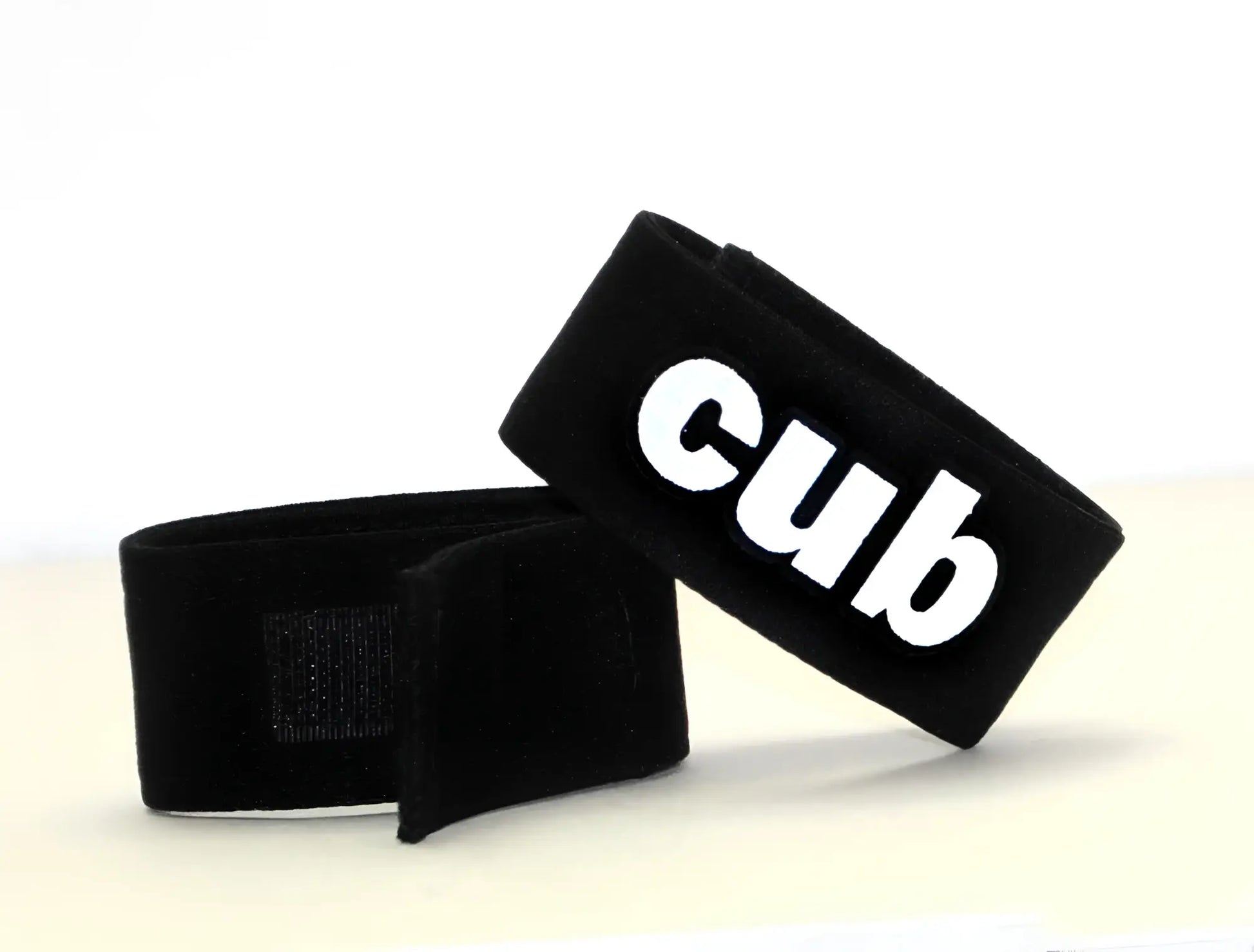 Black velour wristband with white cub logo for wildmant fetish max cock ring cub product