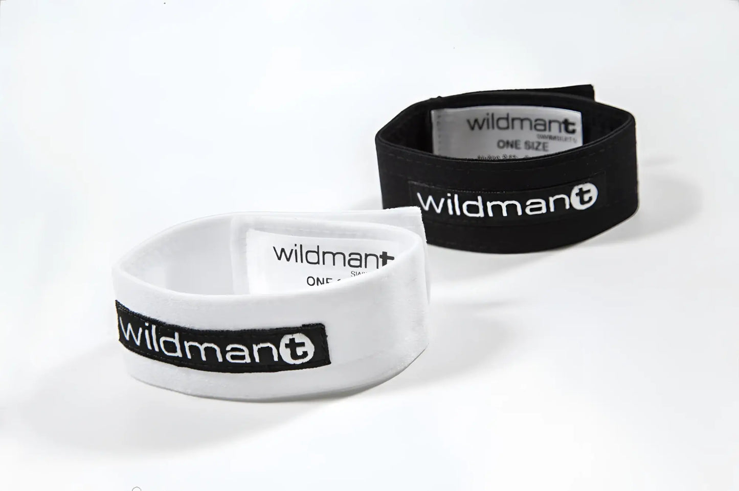 White and black elastic wristbands with wildman plus branding for the wildmant max cock ring product