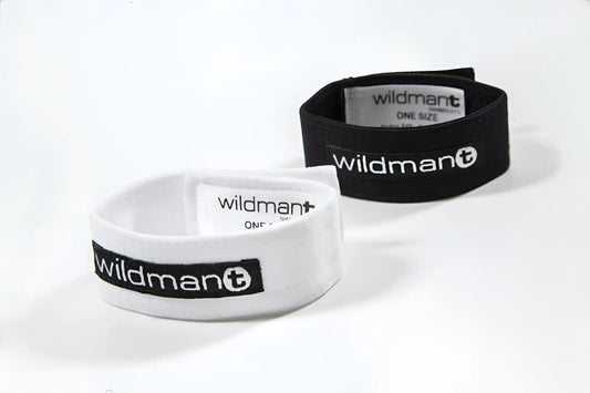 White and black elastic wristbands with wildman plus branding for the wildmant max cock ring product