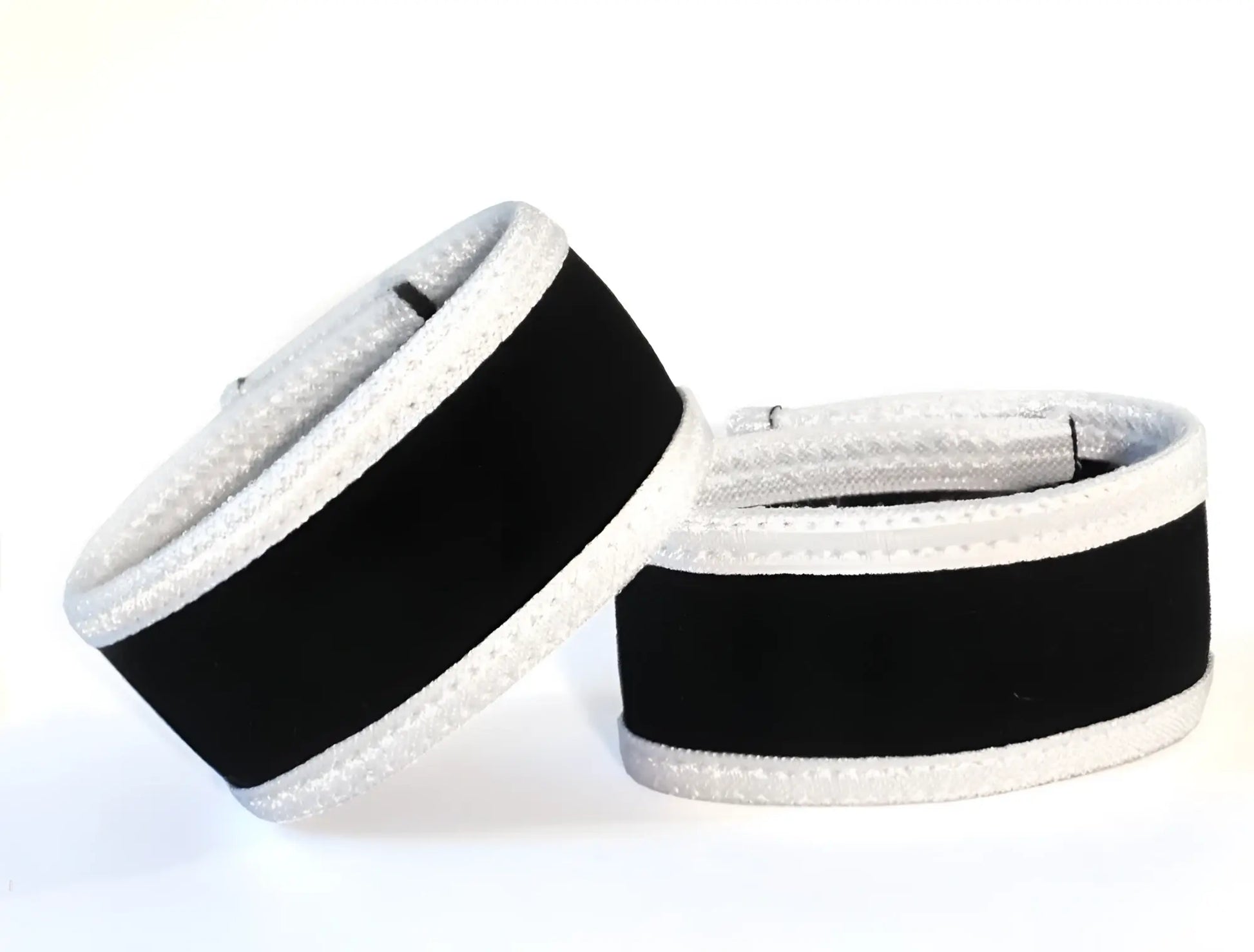 Black and silver textured padded wrist wraps designed for support in WildmanT Max Cock-Rings product line