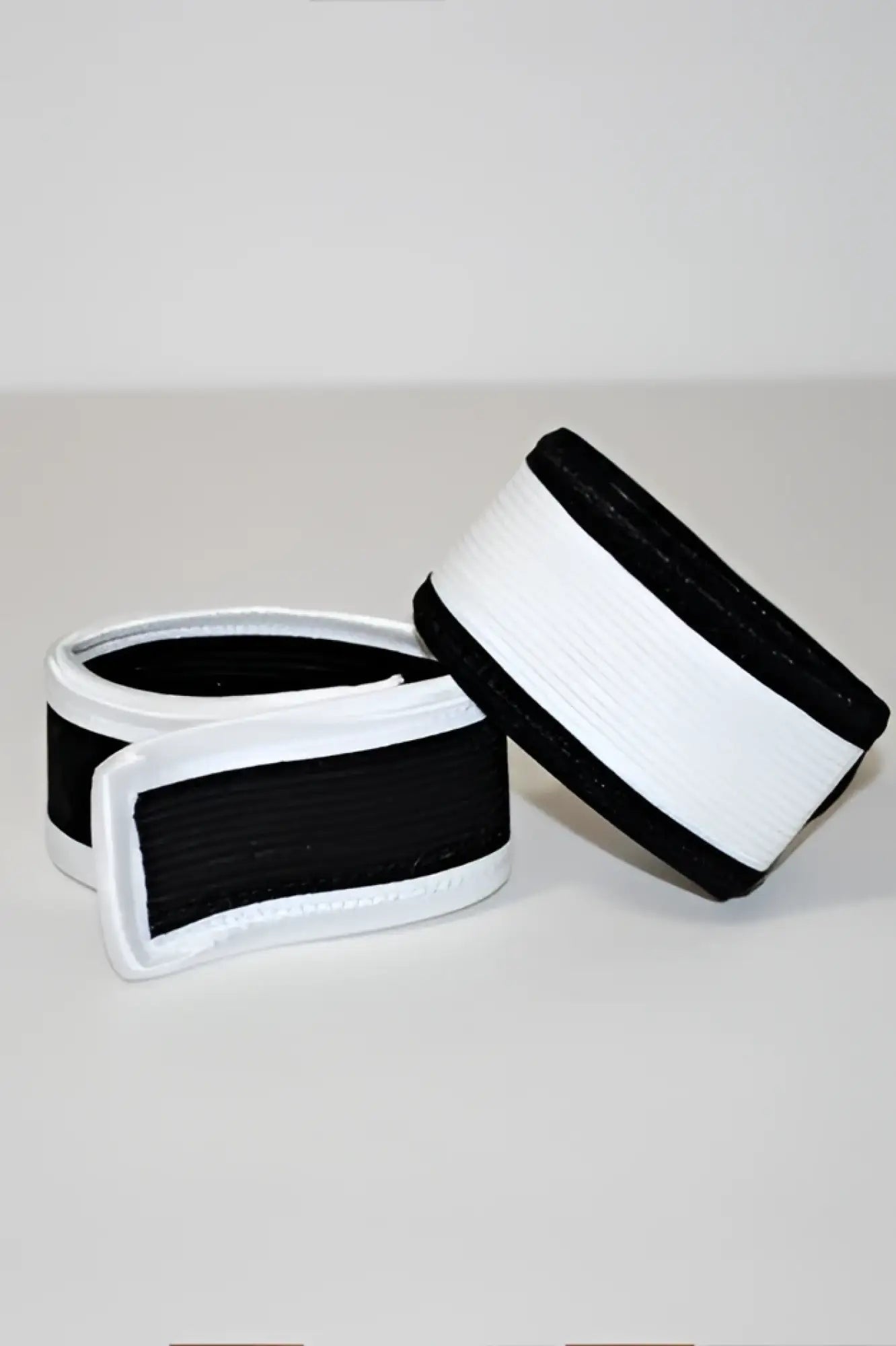 Wildmant max cock-ring elastic wristband black and white with simple clean design made of stretchable material
