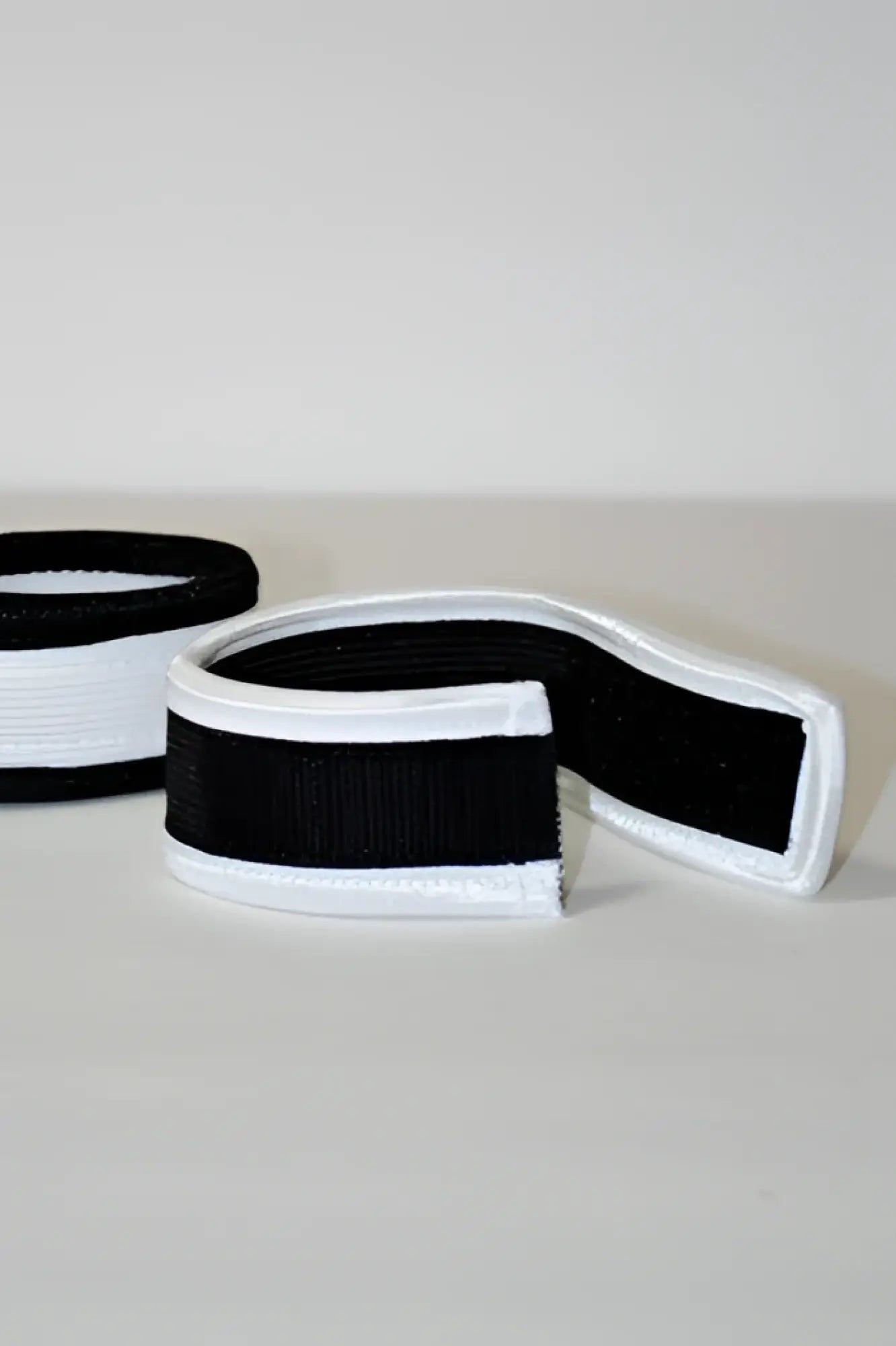 Black and white striped elastic band with smooth stretchy texture for wildmant max cock rings product