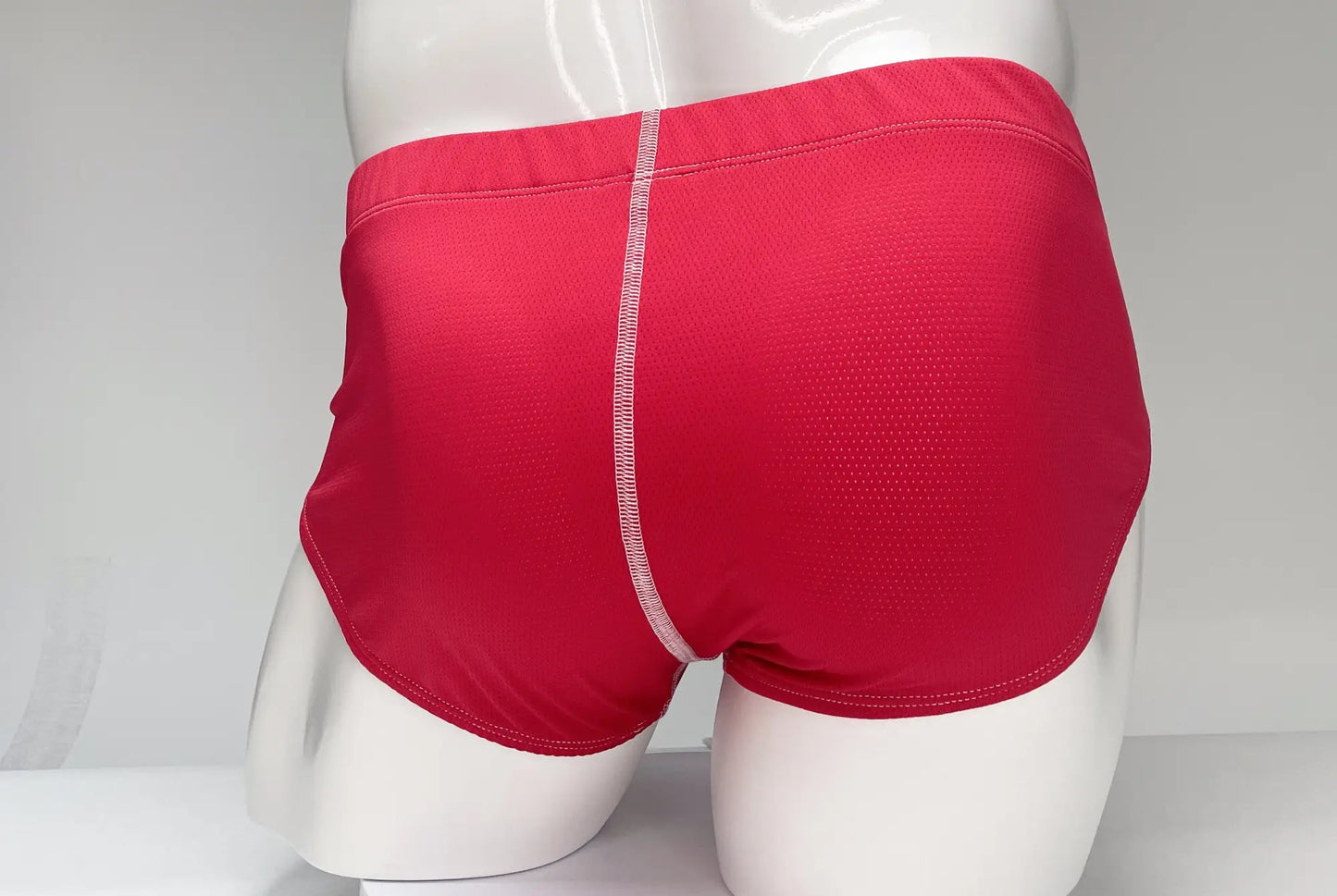 WildmanT mesh brief red athletic briefs with textured fabric and white vertical seam down the center