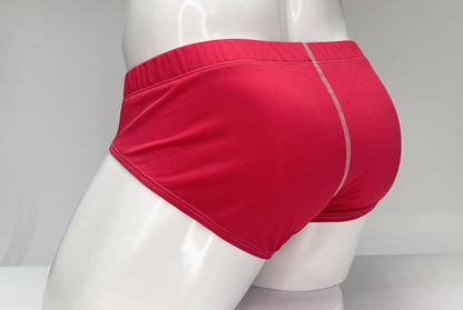 Red wildmant mesh brief featuring textured fabric and white stitching along the waistband