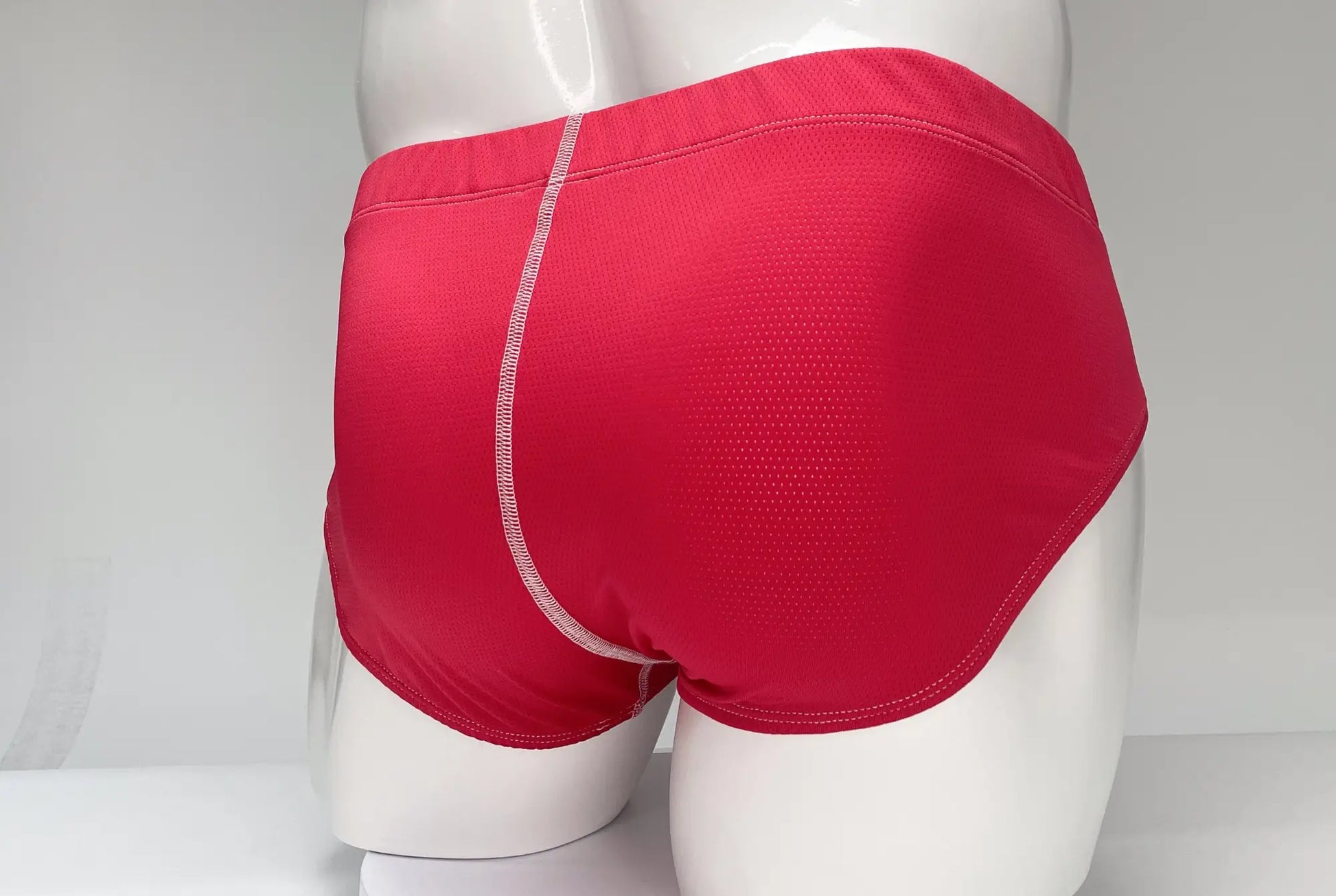 WildmanT mesh brief red bright red athletic briefs with subtle textured pattern and white stitching along center seam