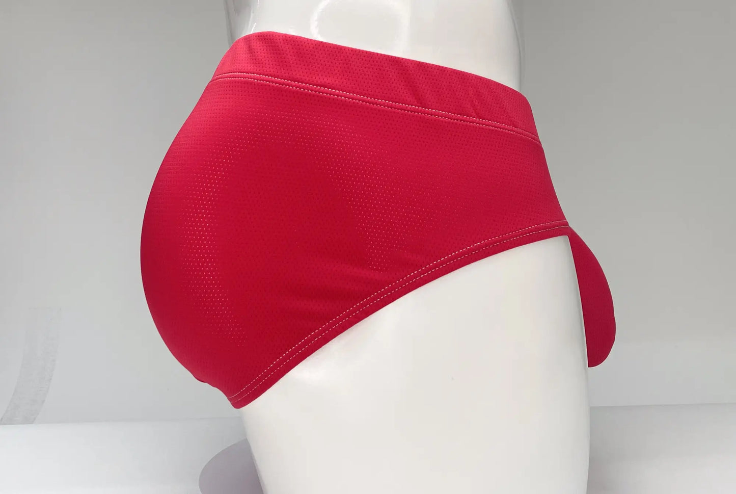 Wildmant mesh brief red bright red athletic briefs with textured mesh fabric and seamless stitching visible from front
