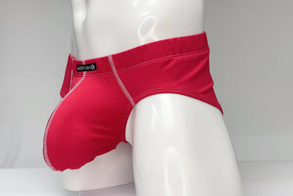 WildmanT mesh brief red bright red swim trunks with subtle textured pattern and white stitching on seams