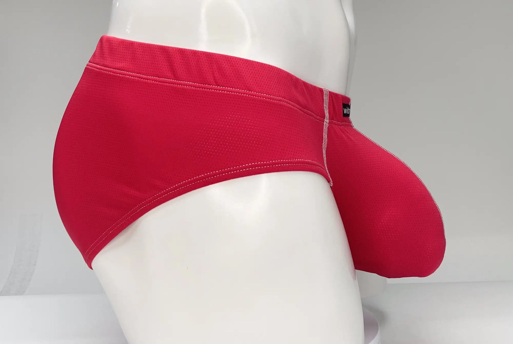 Red WildmanT mesh brief with snug fit and contrasting white stitching along the waistband