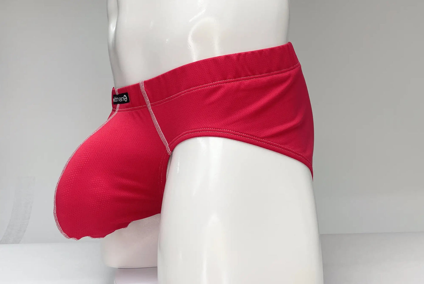 WildmanT mesh brief red vibrant snug fit men’s underwear with contrasting white stitching along the seams