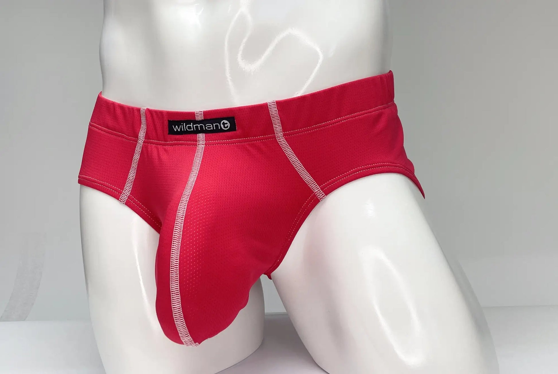 Red wildman wildmant mesh brief in red with white stitching and breathable mesh texture for active wear