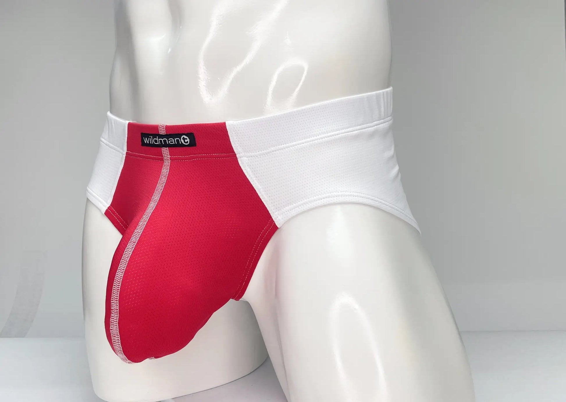 Red and white wildman mesh men’s briefs with branded waistband designed for comfort and breathability