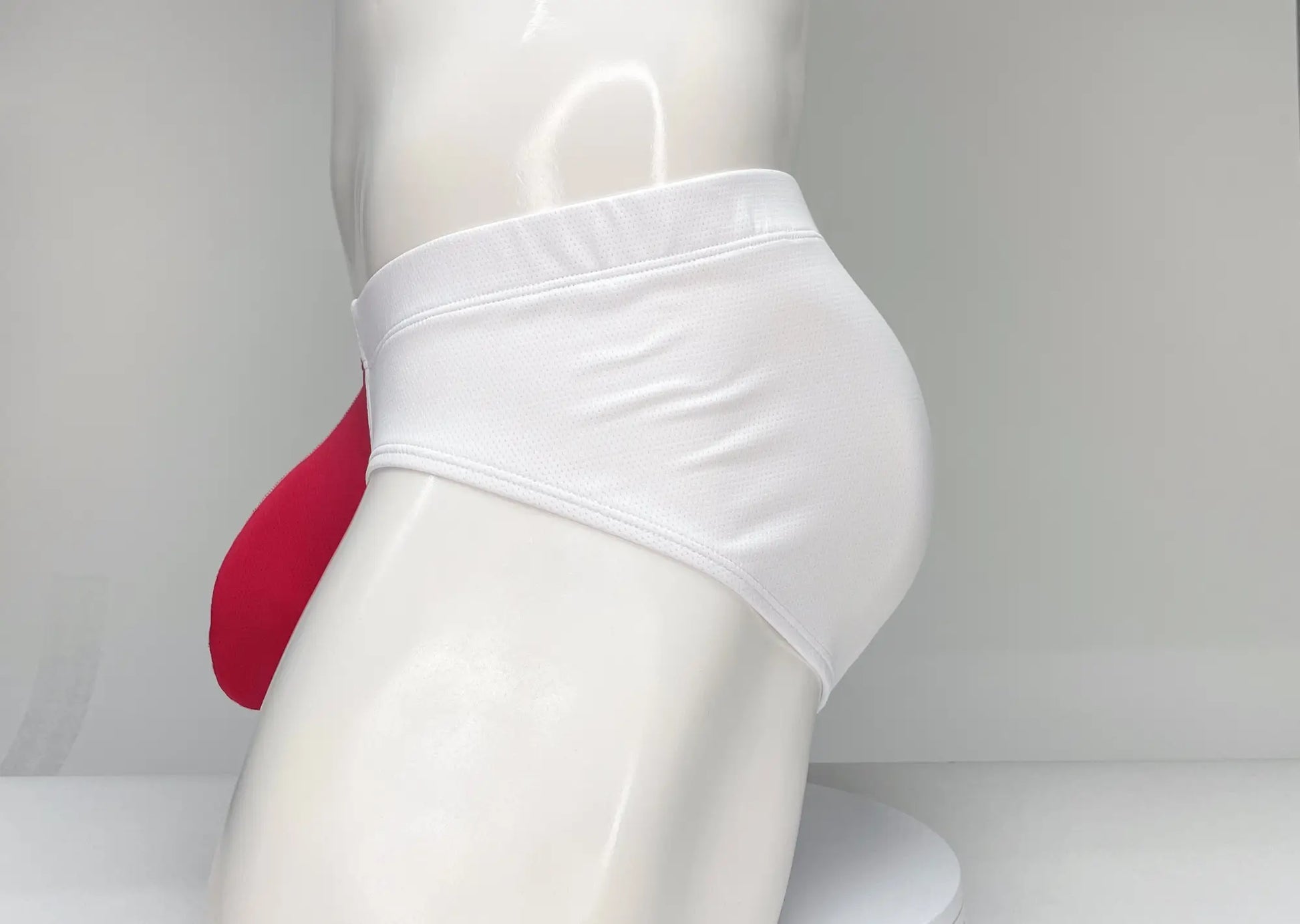 Wildmant mesh brief white and red featuring white mesh fabric with a contrasting red pouch for support