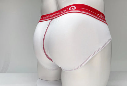 White briefs with red waistband featuring wildman brand name and logo mesh material for breathability
