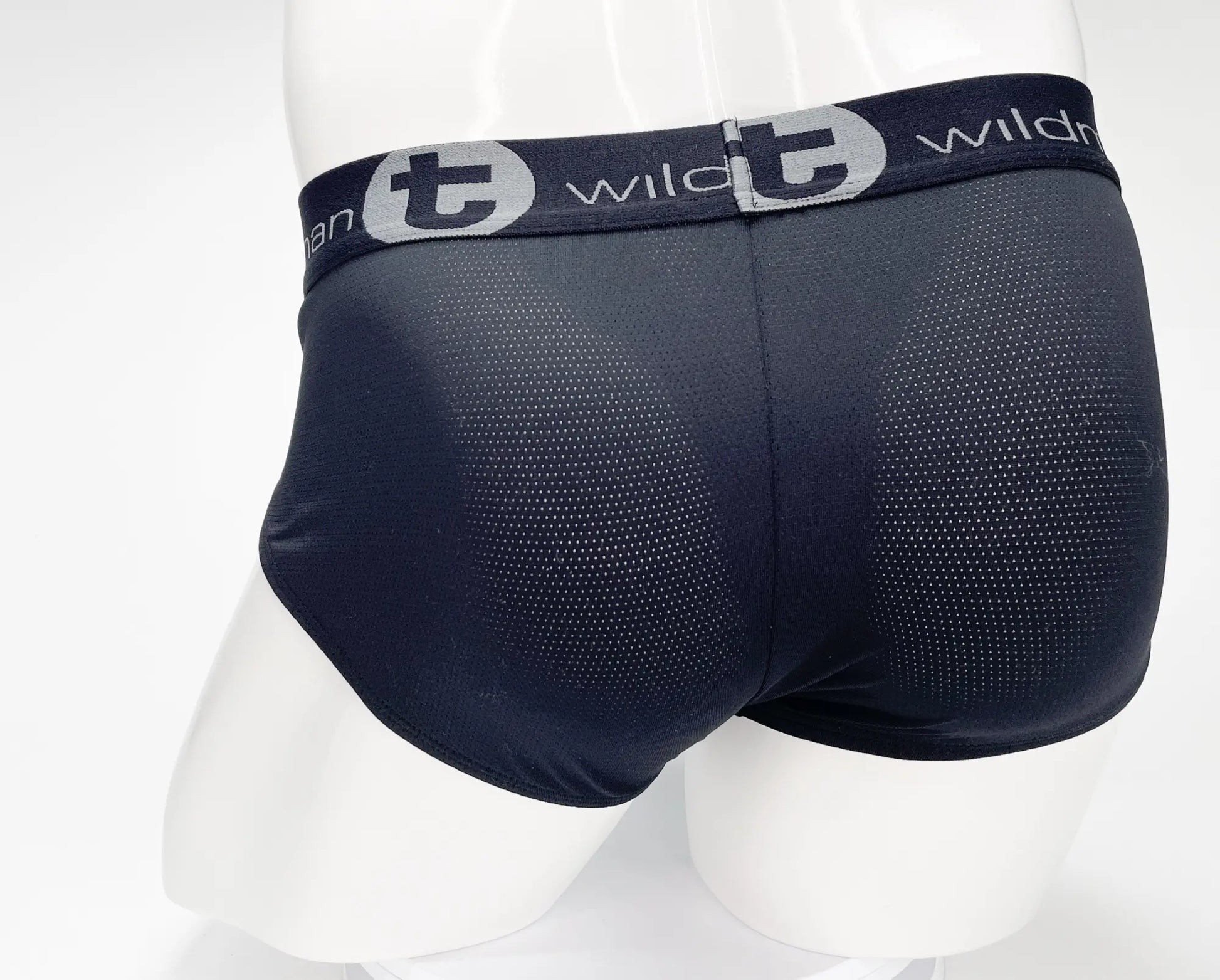 Black WildmanT mesh Monster Cock brief with perforated texture and gray elastic waistband featuring wild logo