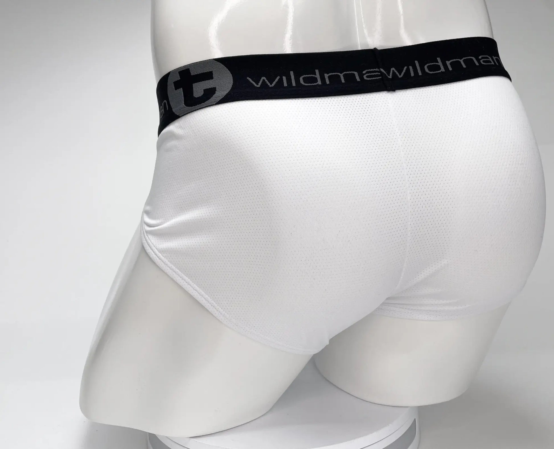 White WildmanT mesh athletic briefs with black elastic waistband featuring wildman brand name and logo