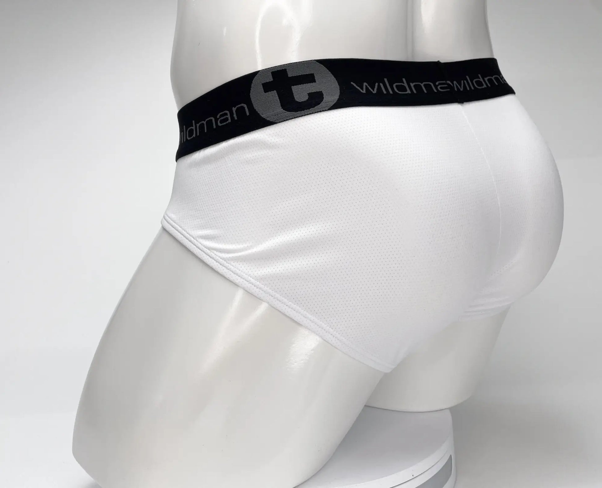 White mesh briefs with black elastic waistband featuring wildman logo from wildmant mesh monster cock brief white collection