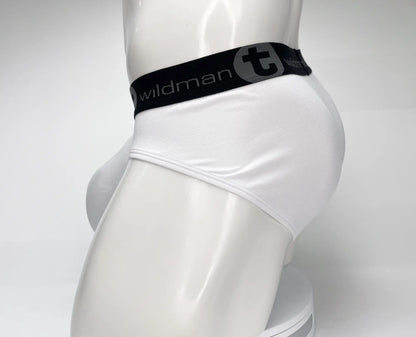 White mens mesh briefs with black waistband featuring wildman logo and stylized t emblem in wildmant mesh monster cock brief white