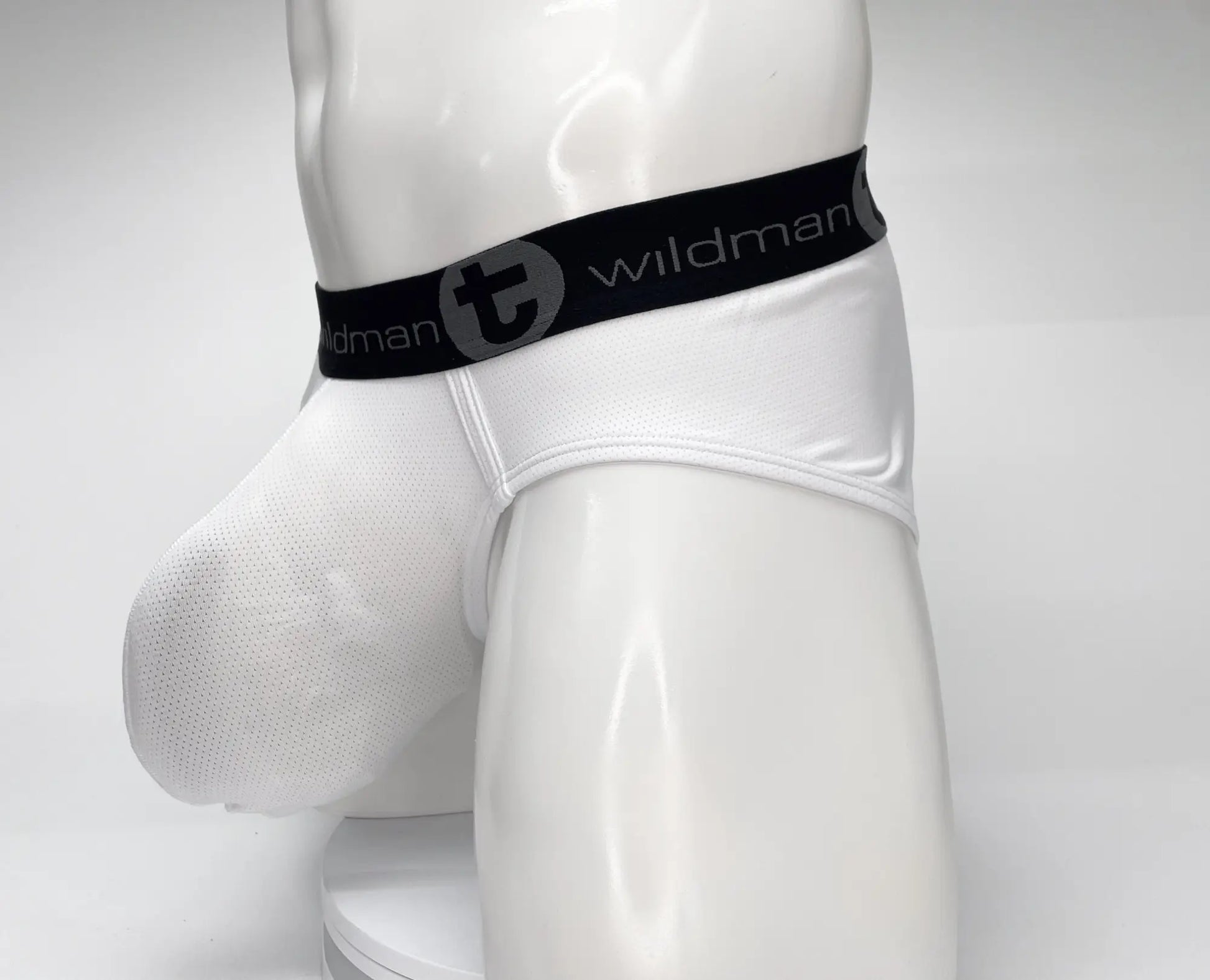 Wildmant mesh monster cock brief white with black elastic waistband and white mesh fabric featuring wildman logo