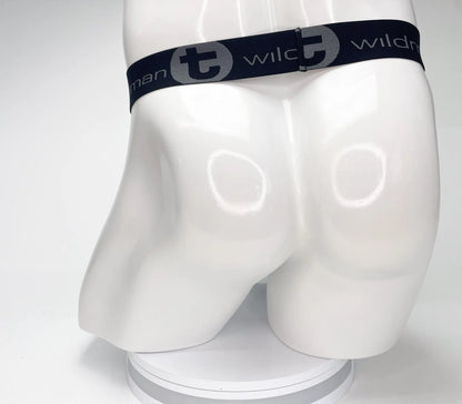 Black elastic waistband of wildmant mesh monster cock strapless pouch with gray logo and stylized t emblem