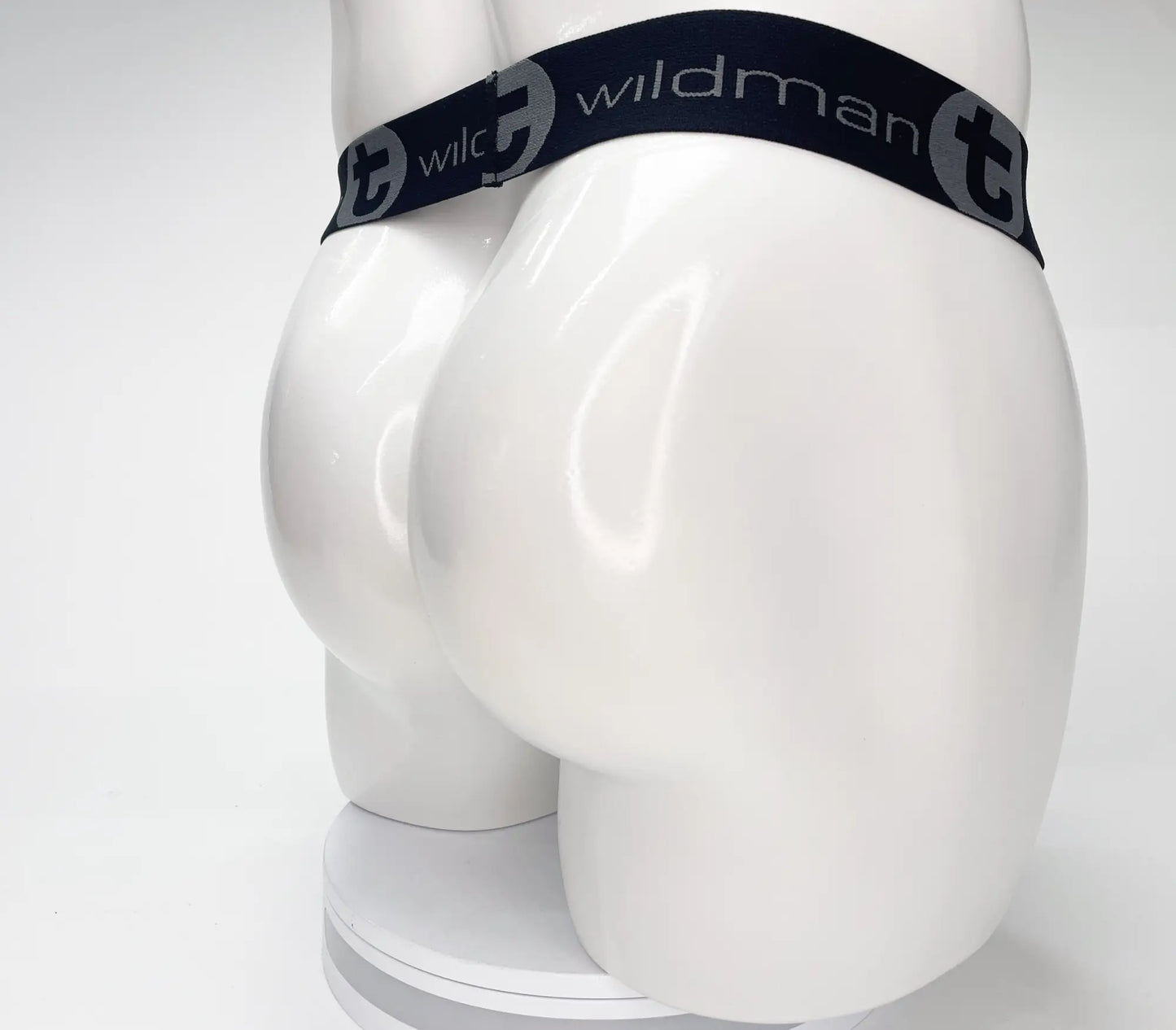 Black elastic waistband with wildman branding in white on wildmant mesh monster cock strapless pouch black