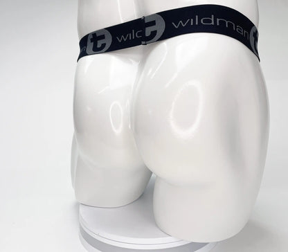 Black elastic waistband with wildman branding on mesh monster cock strapless pouch black displayed on mannequin