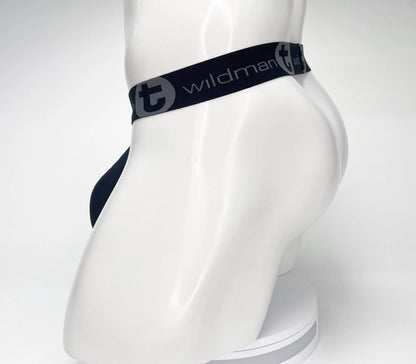 Navy blue wildman briefs with black elastic waistband featuring white wildman logo mesh monster cock strapless pouch black