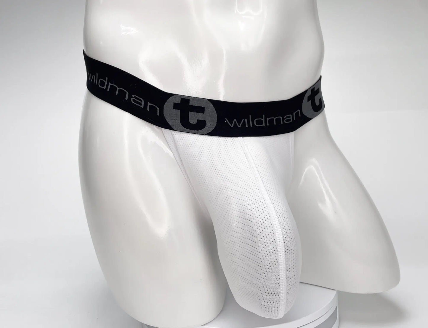 White mesh WildmanT mesh monster cock strapless pouch briefs with black elastic waistband featuring logo