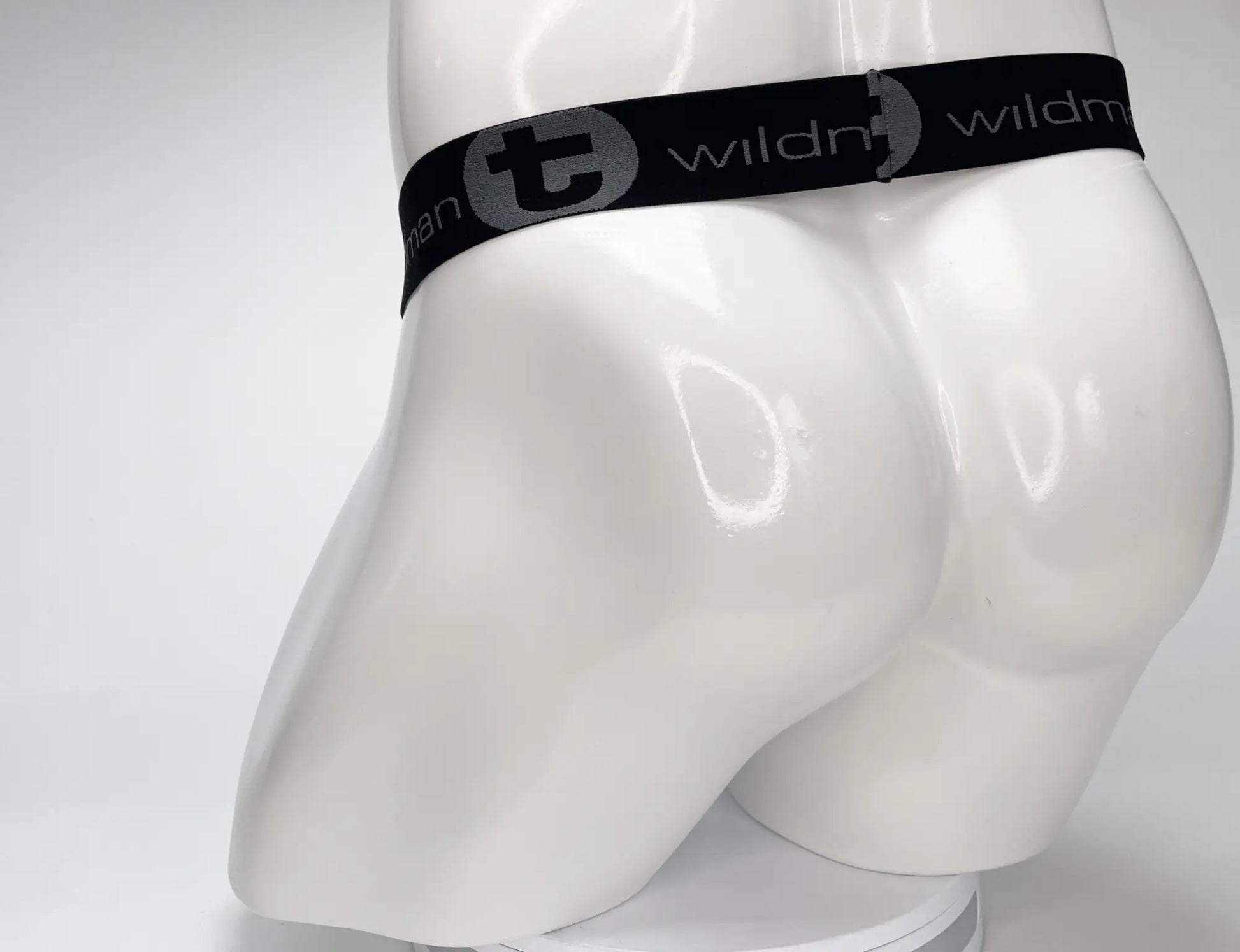 Black elastic waistband with gray wildman logo on the mesh monster cock strapless pouch white product