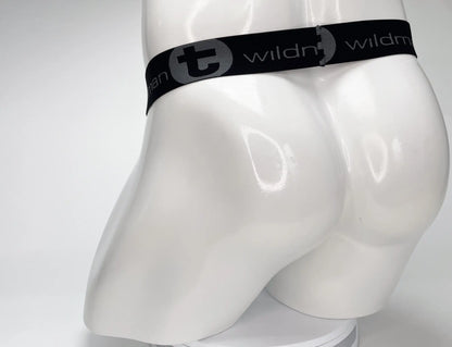 Black elastic waistband with gray wildman logo on the mesh monster cock strapless pouch white product