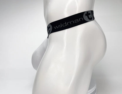 Black elastic waistband with white wildman branding and stylized t logo on wildmant mesh monster cock strapless pouch white displayed on mannequin