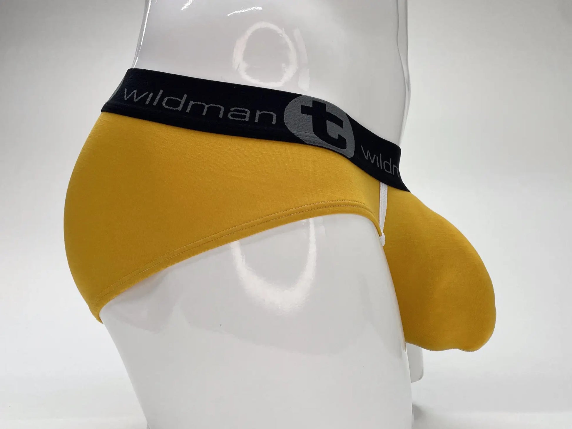 Yellow wildmanT modal big boy pouch brief with black elastic waistband and gray wildman logo lettering