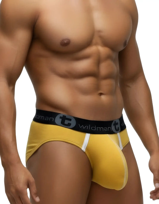Gold modal pouch briefs with white trim details and a black branded WildmanT elastic waistband on a fit male model.