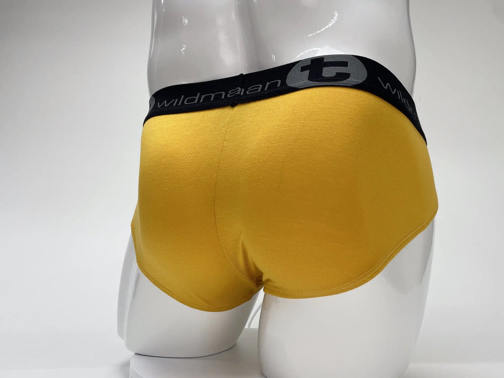 Yellow wildman modal big boy pouch brief in gold with black elastic waistband featuring the brand logo