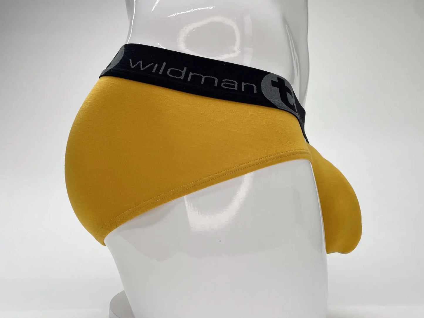 Wildmant modal big boy pouch brief gold in yellow with black wildman logo waistband and circular emblem