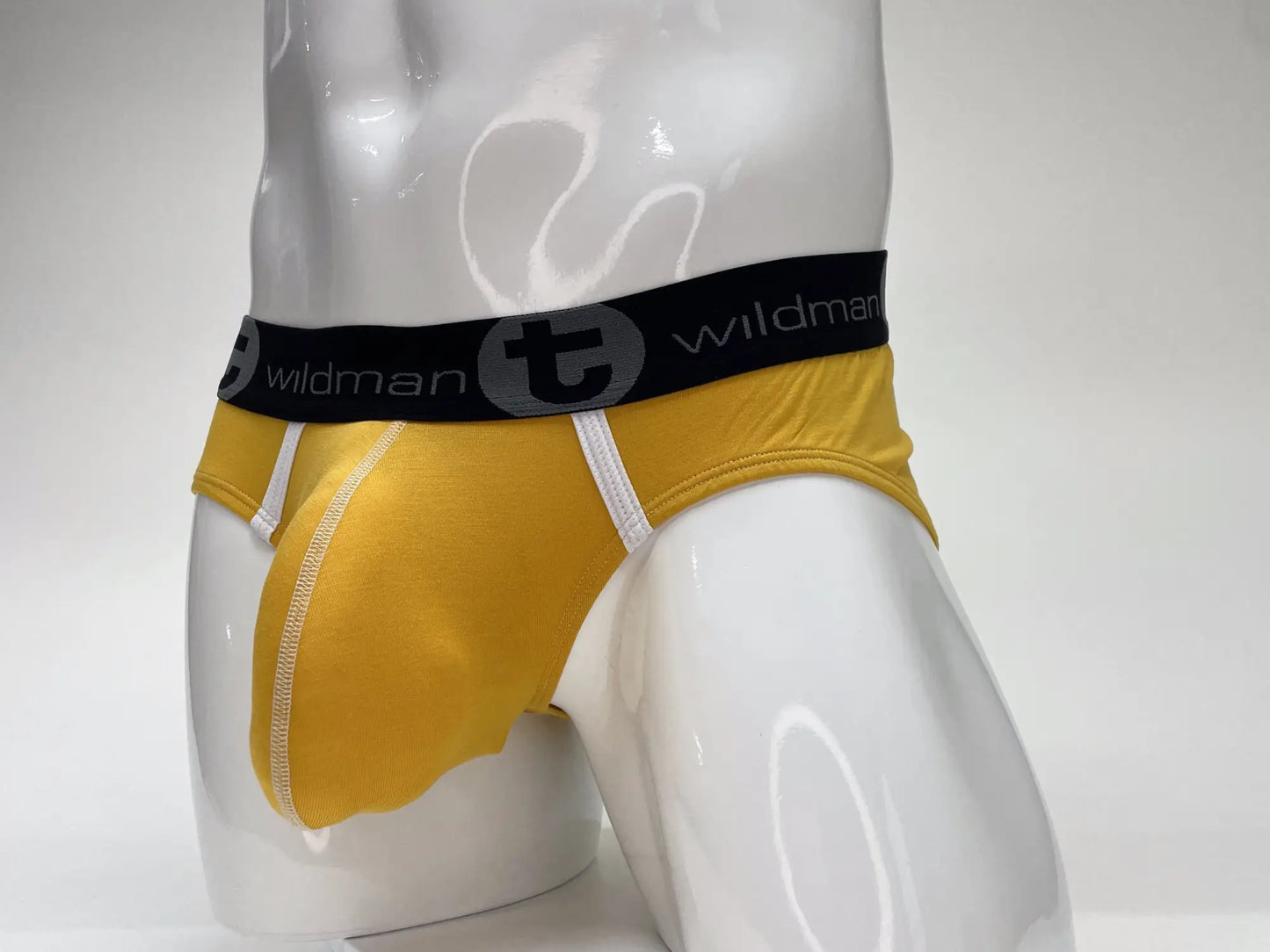 Wildmant modal big boy pouch brief gold in yellow with black waistband and white stitching showcasing a comfortable fit