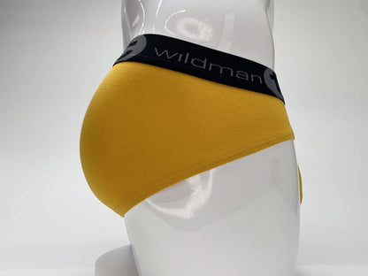 Yellow wildman modal big boy pouch brief gold with black waistband and white wildman logo in front view