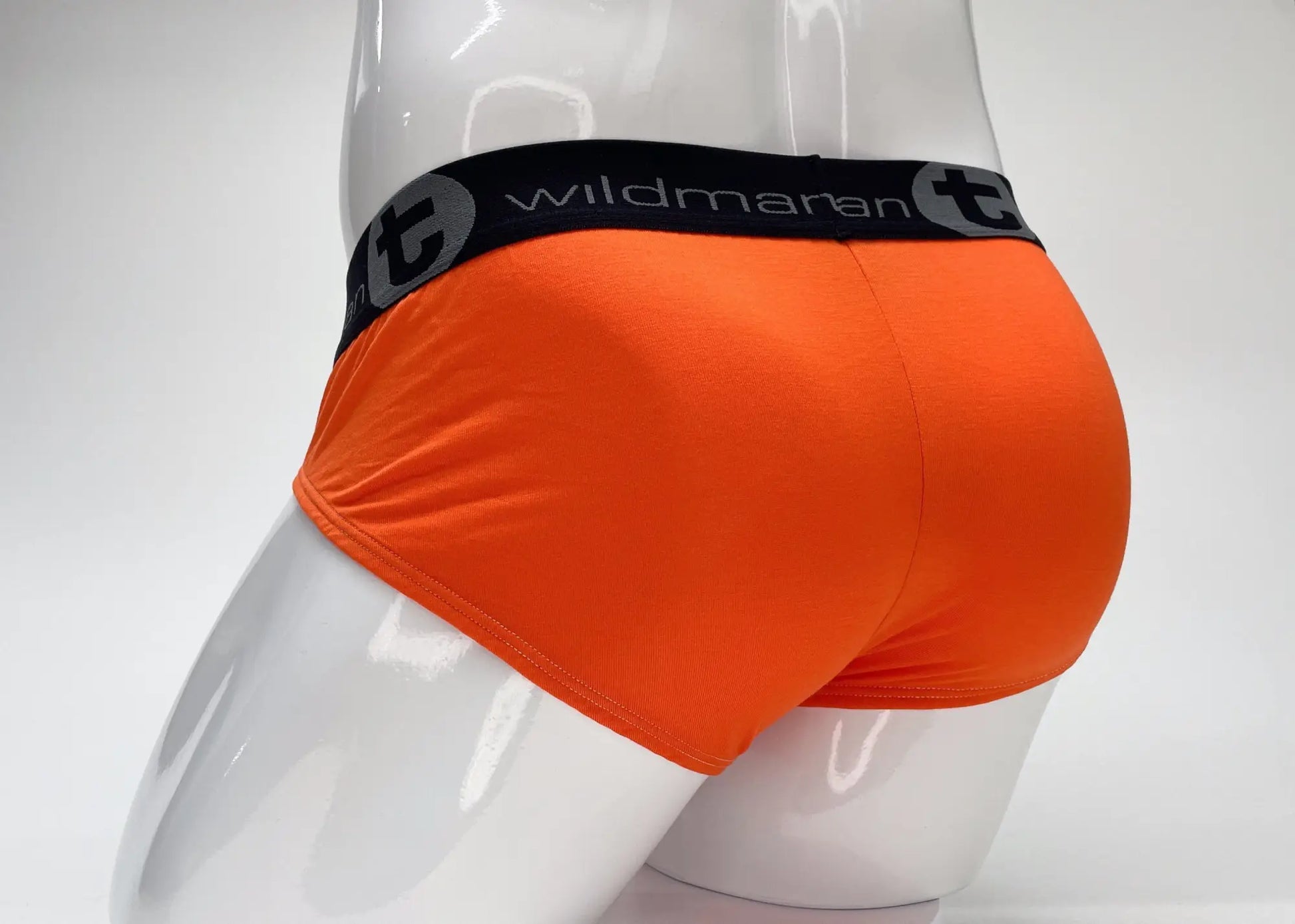 Bright orange wildmanT modal big boy pouch brief with black elastic waistband featuring wildmaran logo