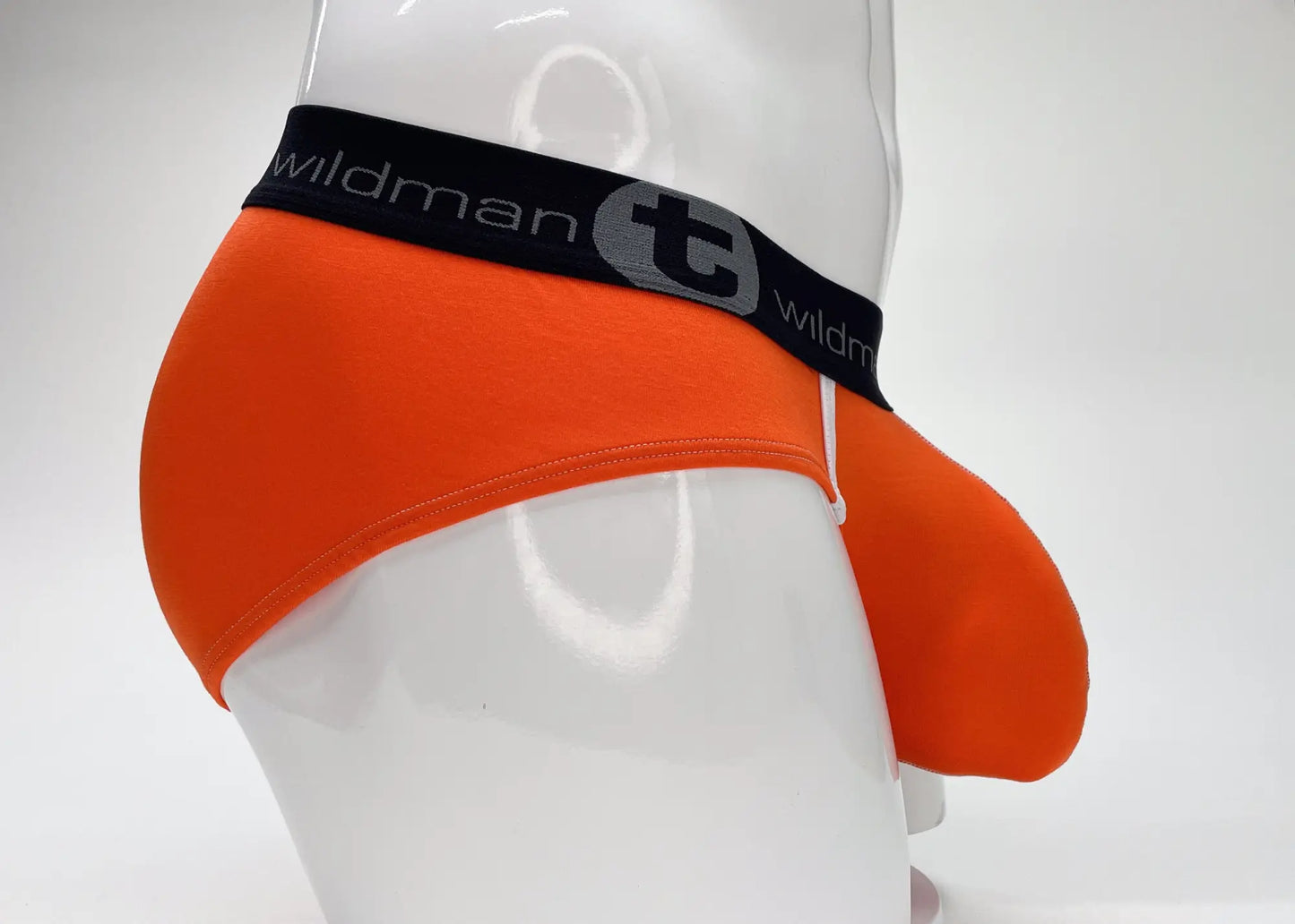Bright orange wildmant modal big boy pouch brief with black elastic waistband and stylized t emblem