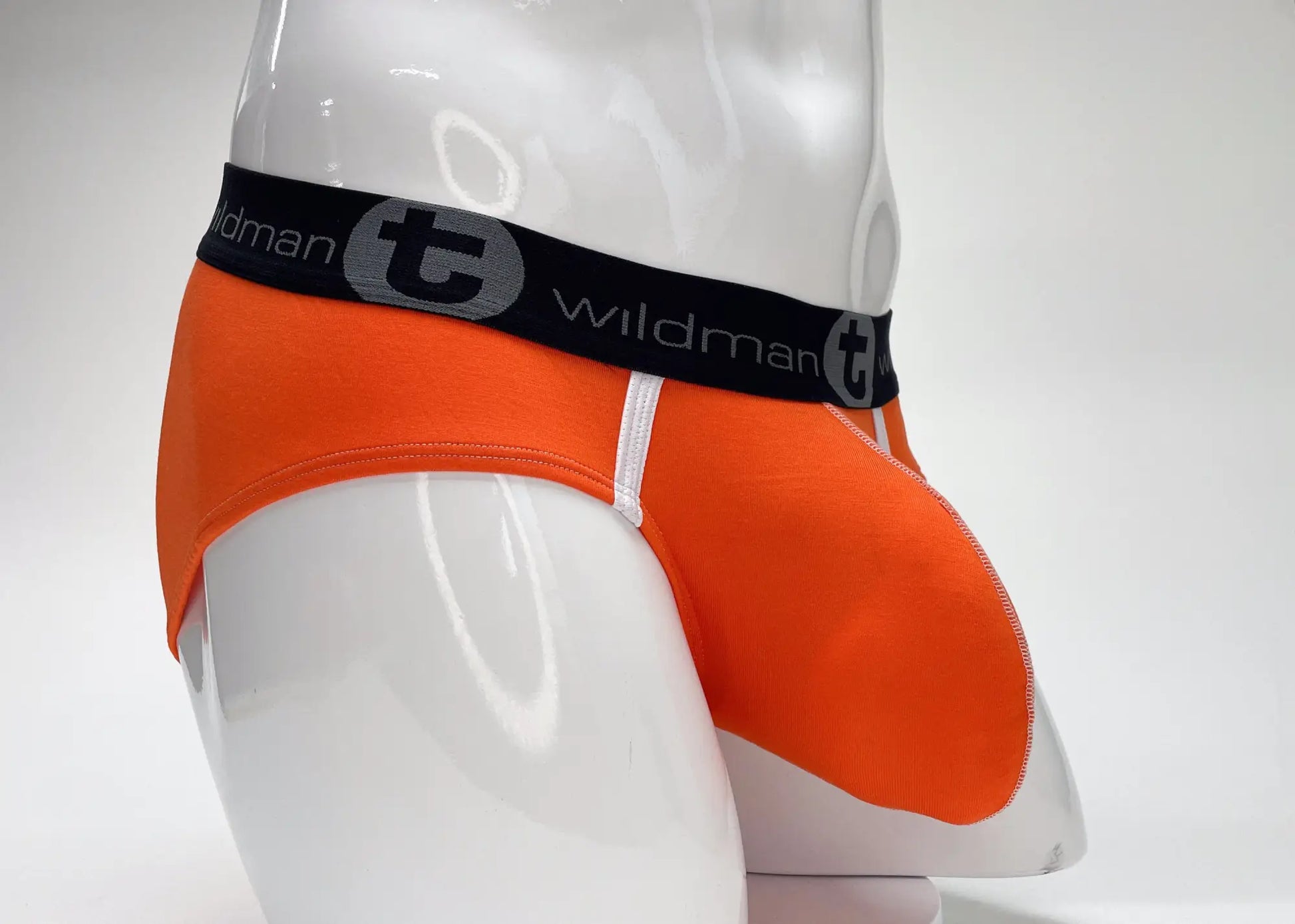 Orange wildmant modal big boy pouch brief with black waistband and gray emblem for comfortable support