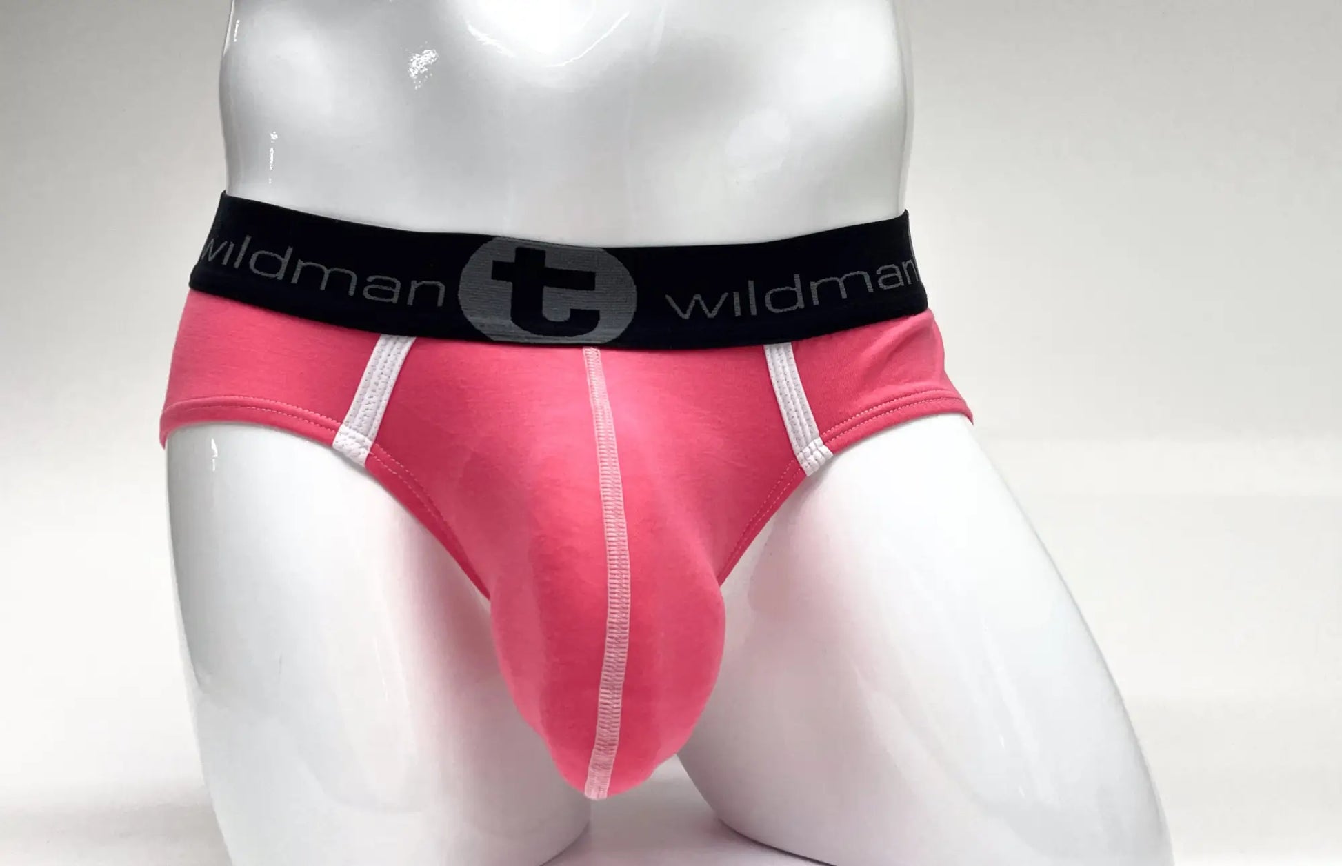 Pink wildman modal big boy pouch briefs with black waistband featuring t logo and white side stitching
