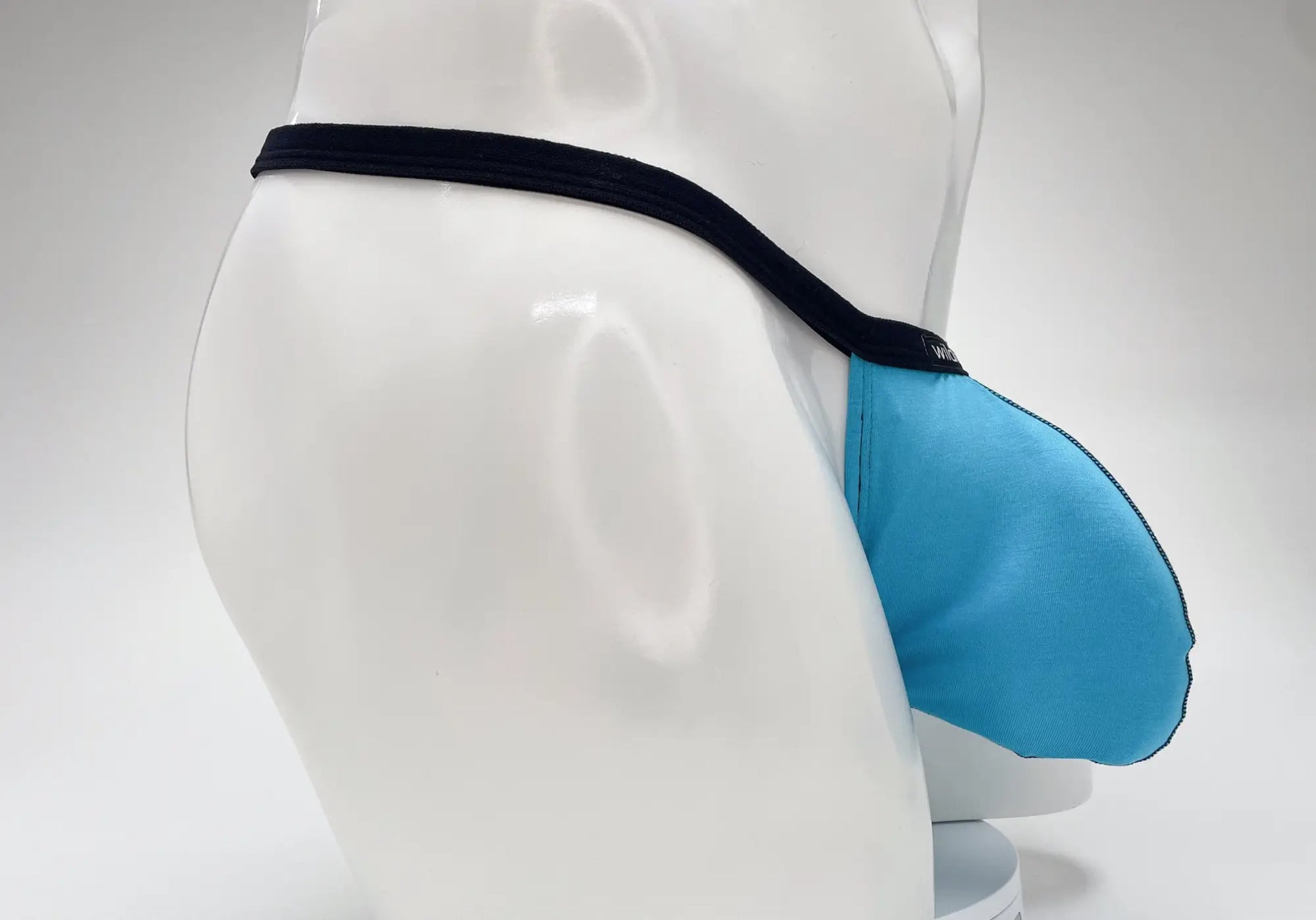 Wildmant modal micro thong big boy pouch in baby blue with a black elastic waistband made of soft modal fabric