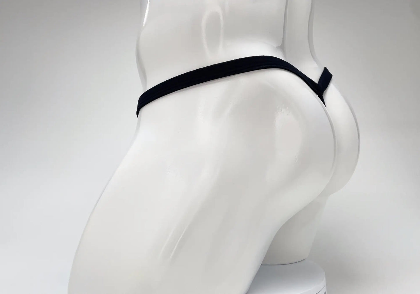 Wildmant modal micro thong big boy pouch baby blue with black elastic waistband and side tab on white mannequin