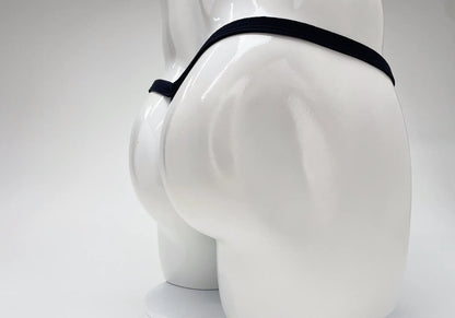 Black elastic waistband modal micro thong with big boy pouch displayed on white mannequin front view