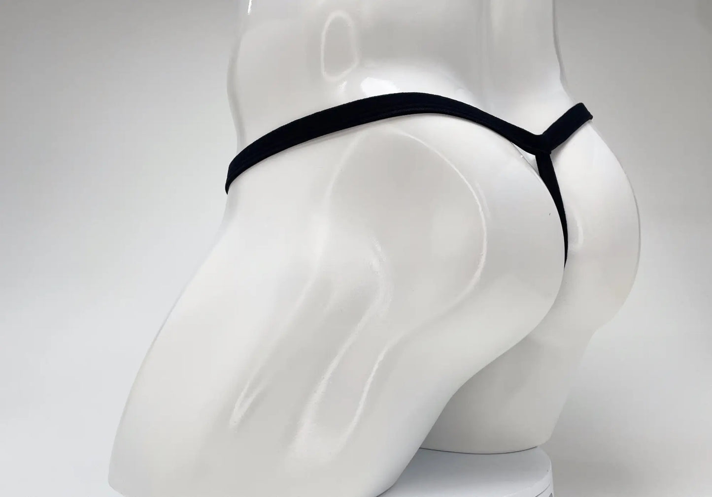 Black wildmant modal micro thong with sleek minimalist design and big boy pouch in baby blue fabric