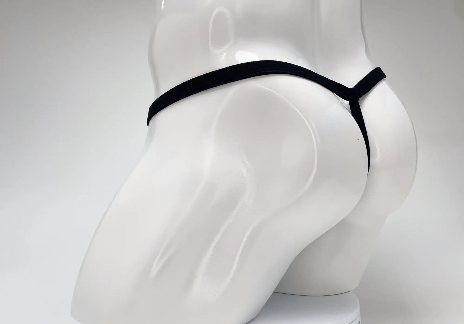 Black wildmant modal micro thong with sleek minimalist design and big boy pouch in baby blue fabric