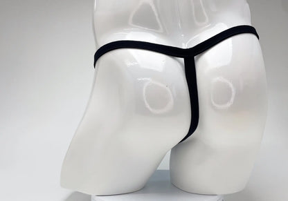 Black thong displayed on white mannequin highlighting wildmant modal micro thong big boy pouch in baby blue color