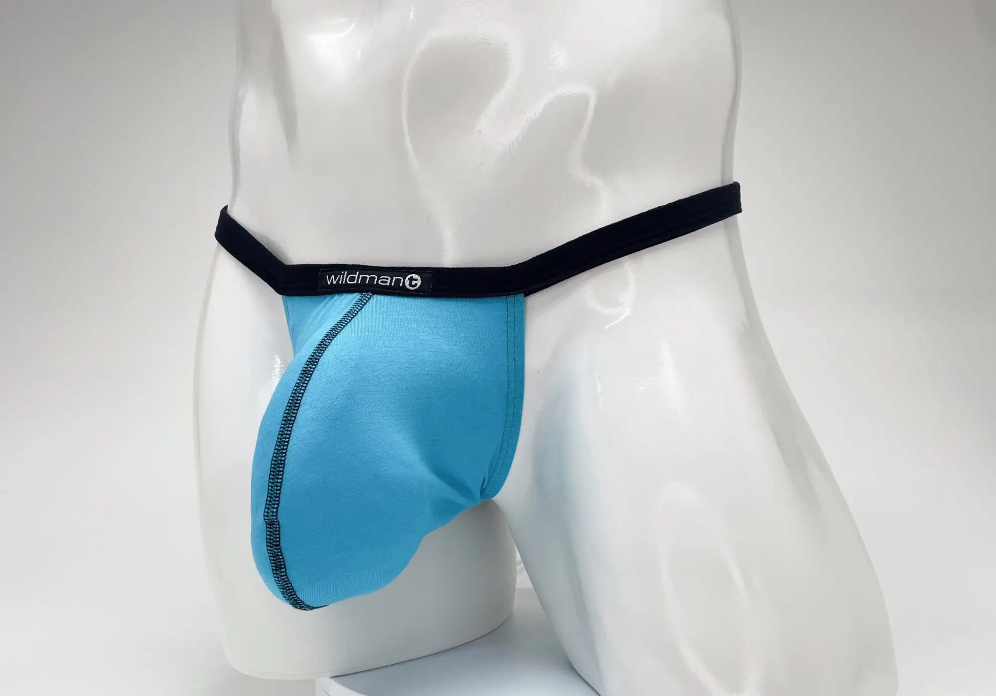 WildmanT modal micro thong in baby blue with black elastic waistband and stitched seam detail in front pouch design