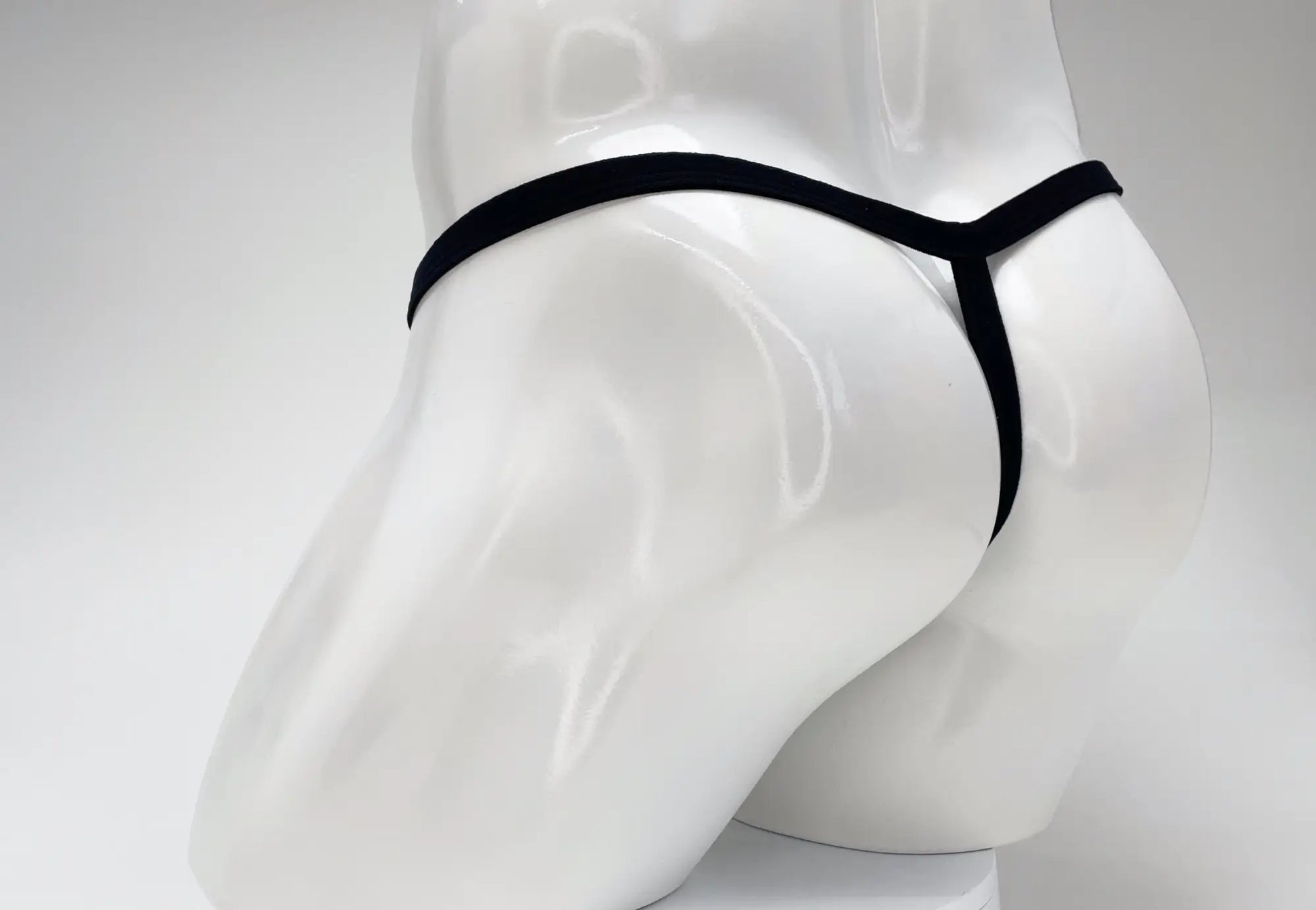 Wildmant modal micro thong black with sleek minimalist design and big boy gold pouch for comfortable wear