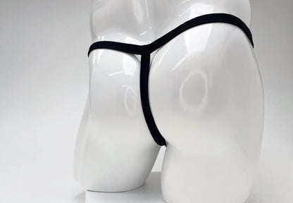 Black modal micro thong with a thin waistband and minimalist T-back design on a glossy white mannequin.